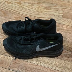 Nike Black Athletic Shoes with Silver Swoosh